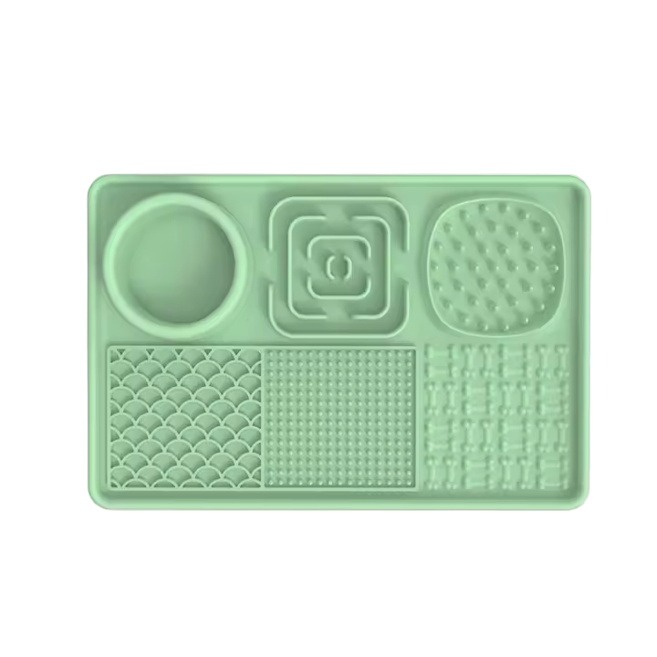 Green silicone mat with textured sections on a white background